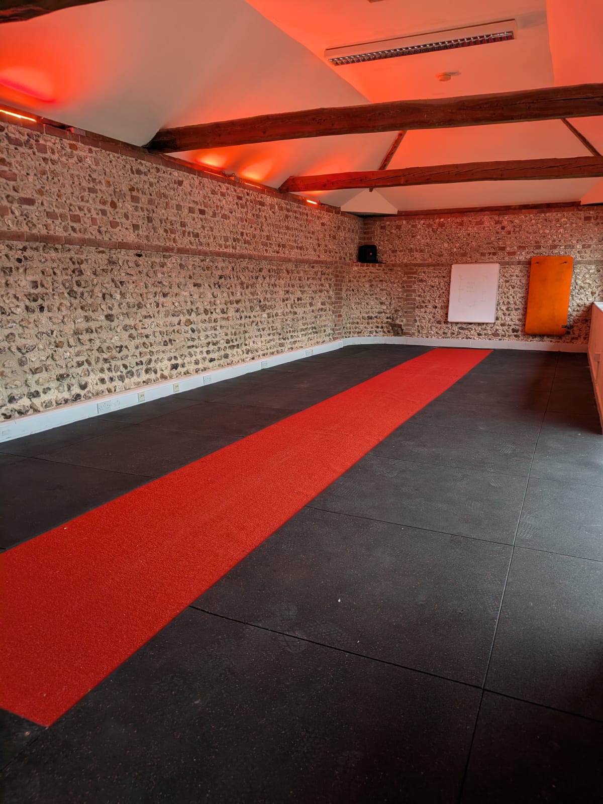 The on-site class studio at Astons with its red training track