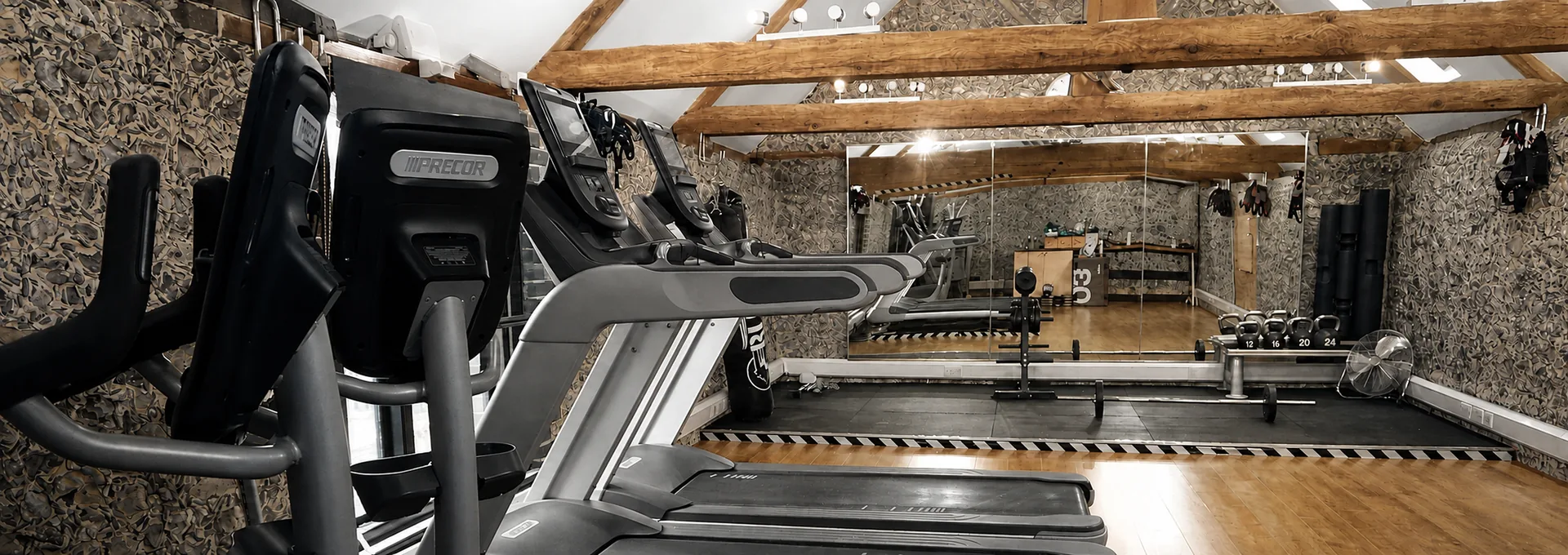 Colourised photograph: The training floor and original beams inside Astons