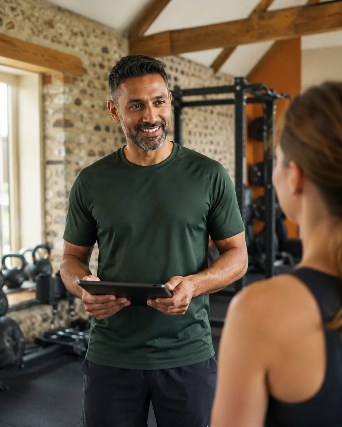 Concept photograph of a trainer discussing a workout with a member